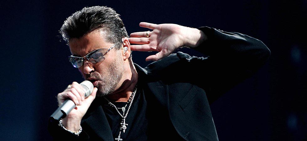 George Michael performs during a concert in Amsterdam in 2007.